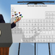 Condoleezza Rice displays for reporters one of the many varieties of atoms Iran is believed to already possess.